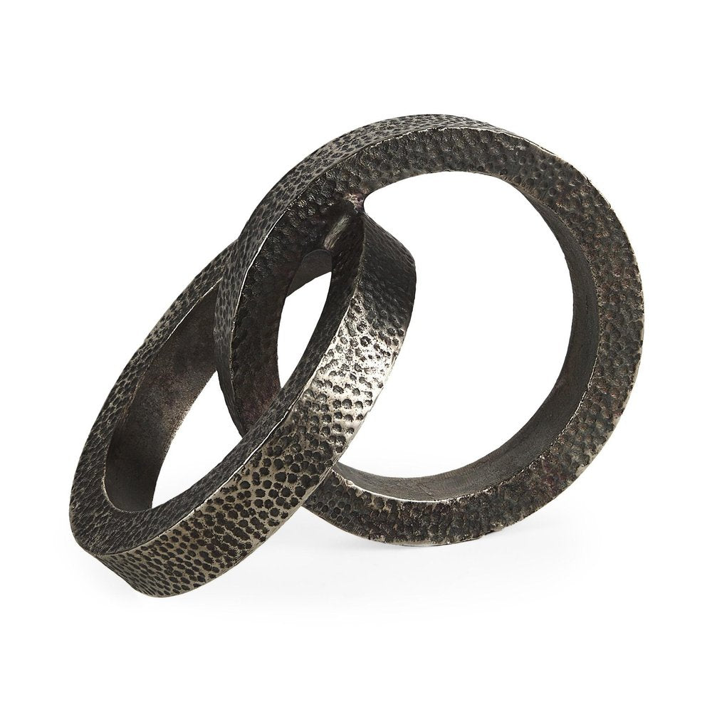 Two Ring Gray Hammered Metal Sculpture on a white background