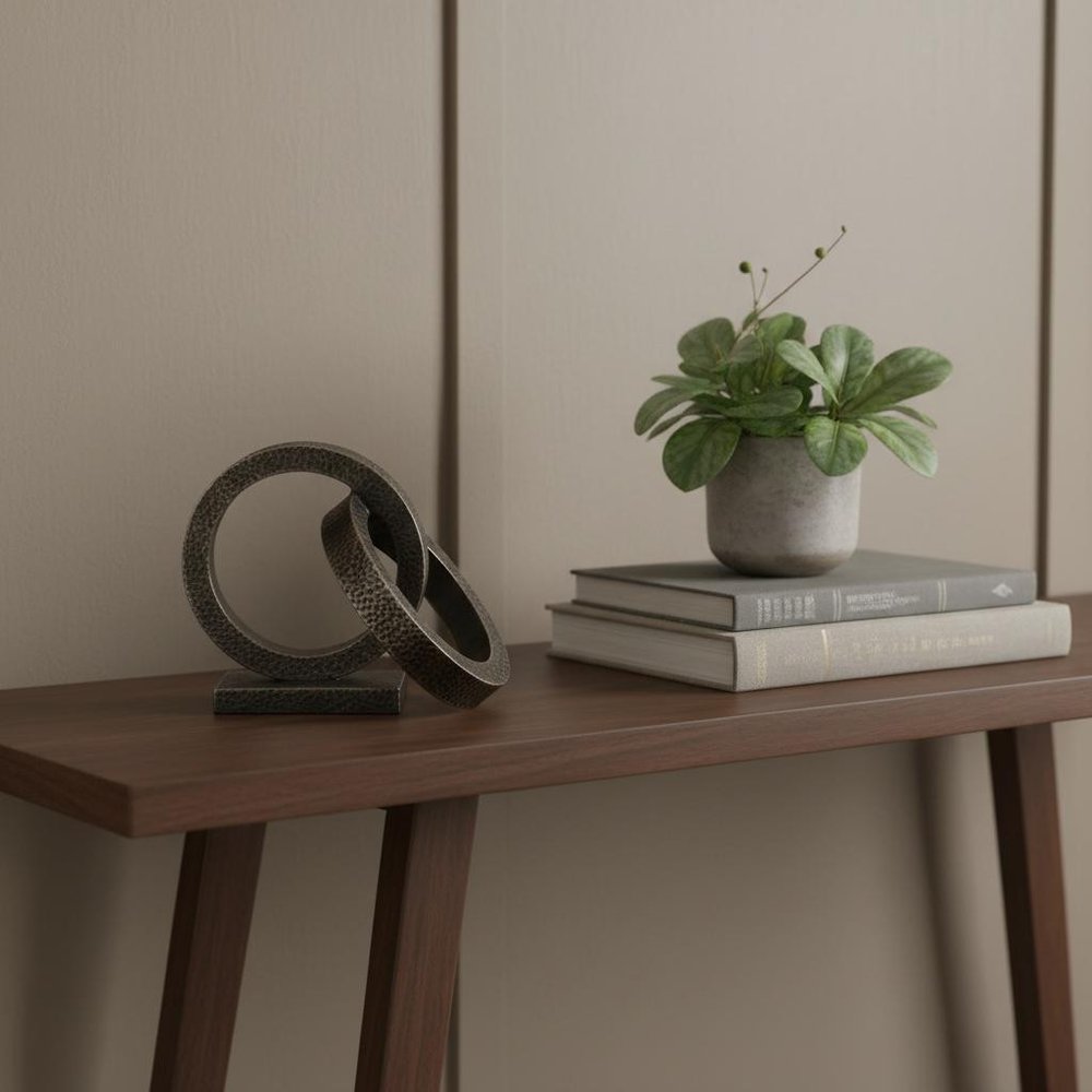 Two Ring Gray Hammered Metal Sculpture in a home interior