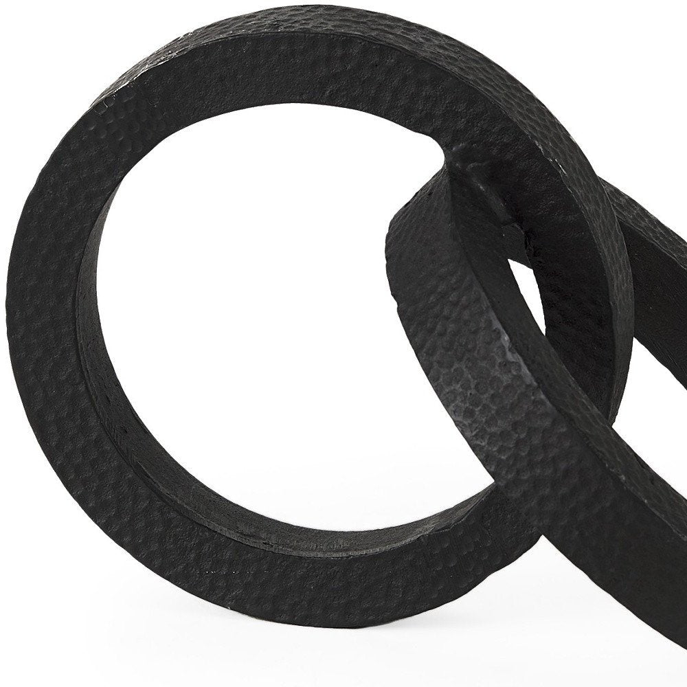 Two Ring Black Hammered Metal Sculpture on a white background