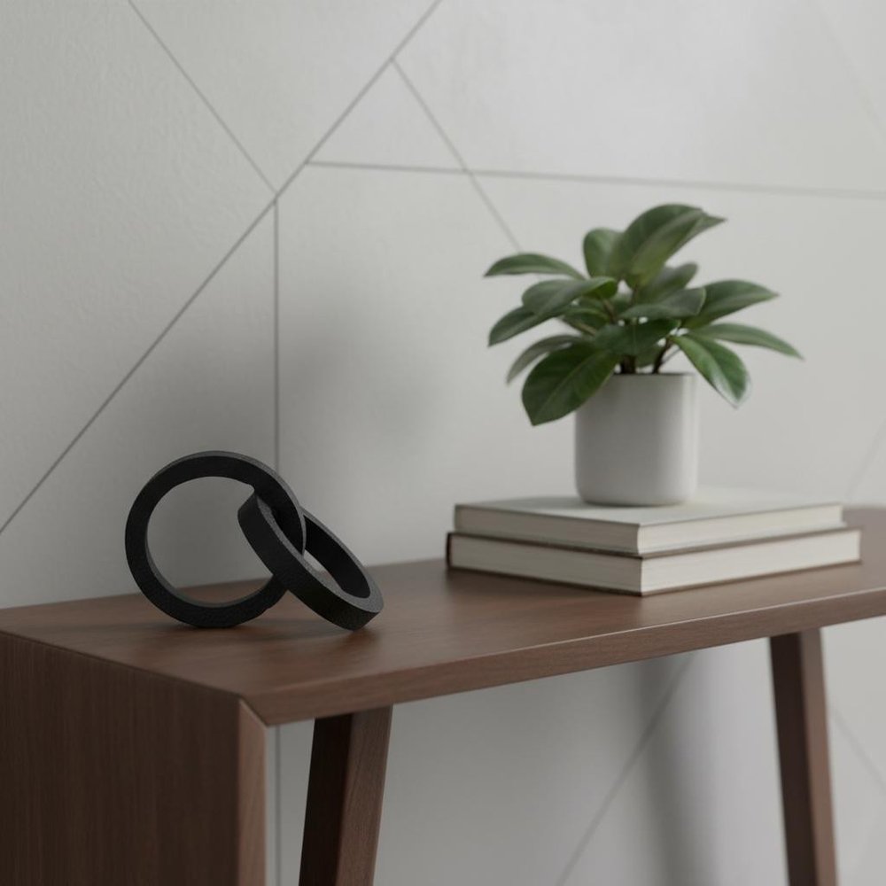 Two Ring Black Hammered Metal Sculpture in a home interior