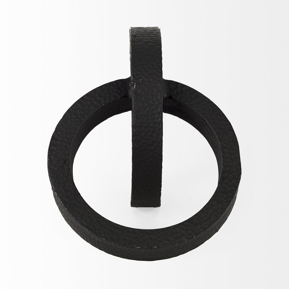 Two Ring Black Hammered Metal Sculpture on a white background