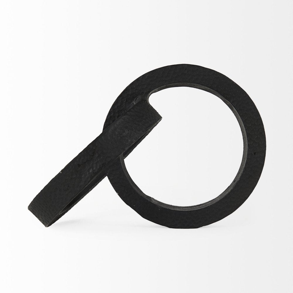 Two Ring Black Hammered Metal Sculpture on a white background