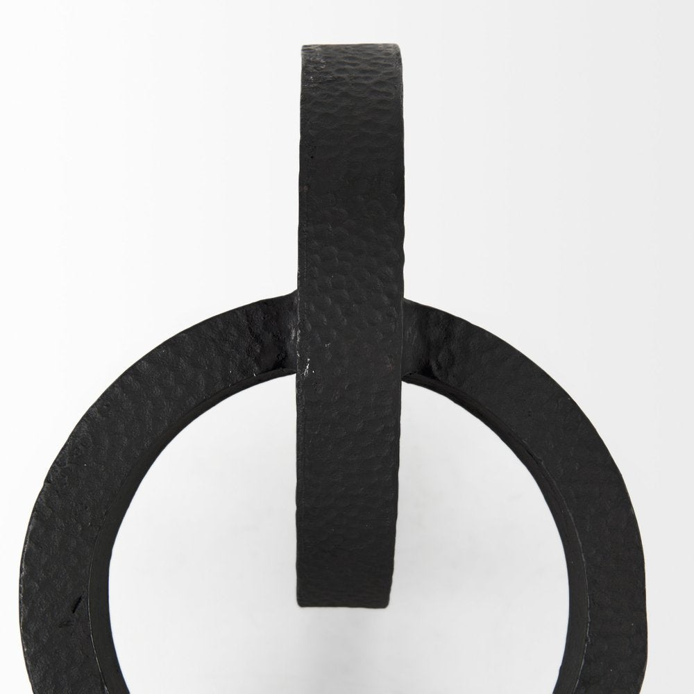 Two Ring Black Hammered Metal Sculpture on a white background