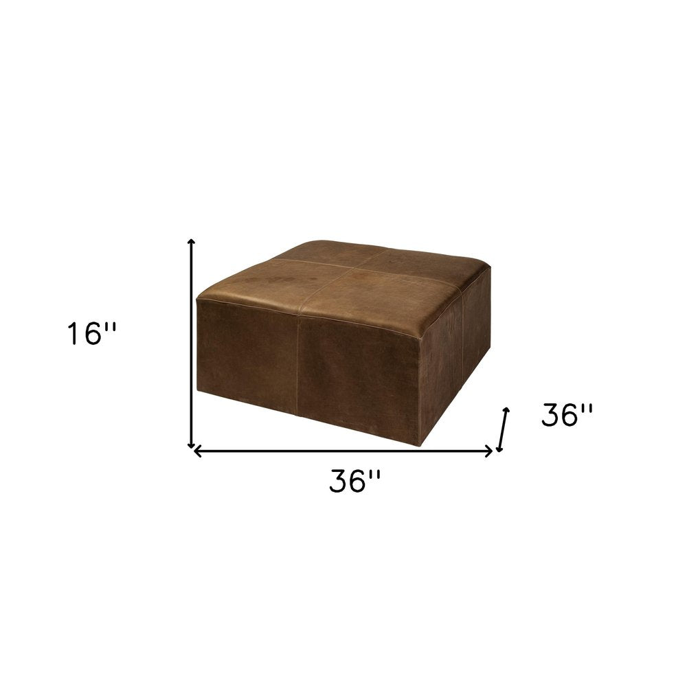 36" Brown Genuine Leather Cube Ottoman. Ottoman isolated on a plain white background, finished in brown leather.