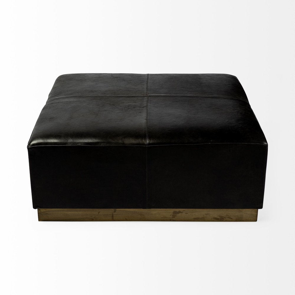 36" Black Faux Leather and Brown Footstool. Ottoman isolated on a plain white background, in a black faux leather finish.