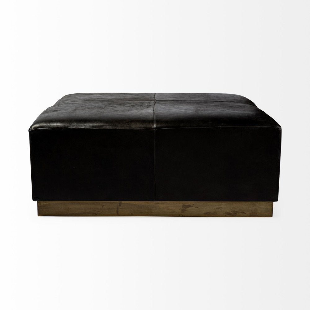 36" Black Faux Leather and Brown Footstool. Ottoman isolated on a plain white background, finished in black faux leather.
