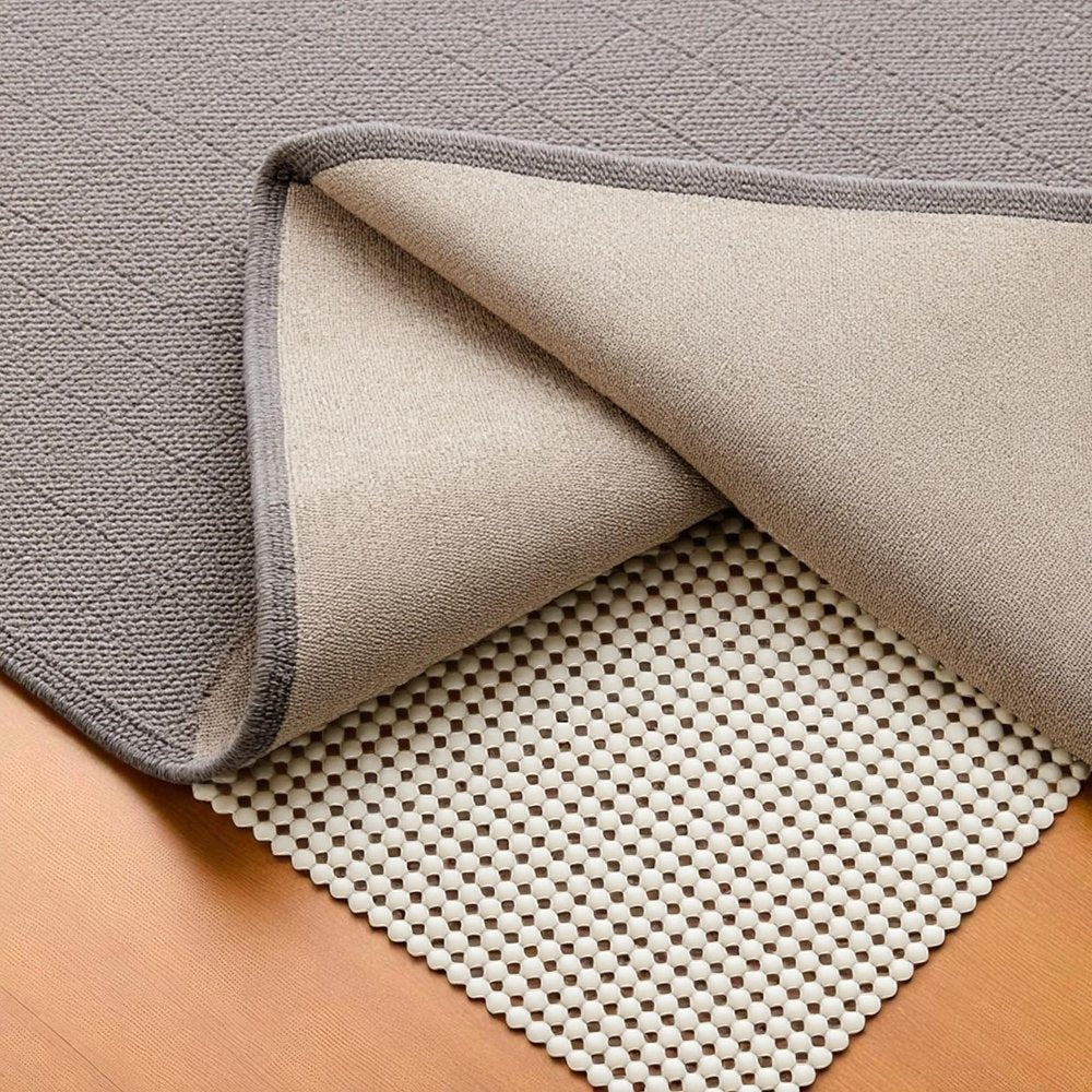 6' x 9' Ivory Striped Weave Non Slip Rug Pad shown as a full-frame view of the tan and gray surface.