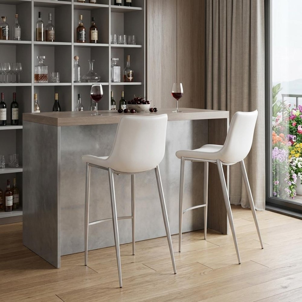Set of Two 30" White And Silver Faux Leather And Steel Low Back Bar Height Bar Chairs in a home interior