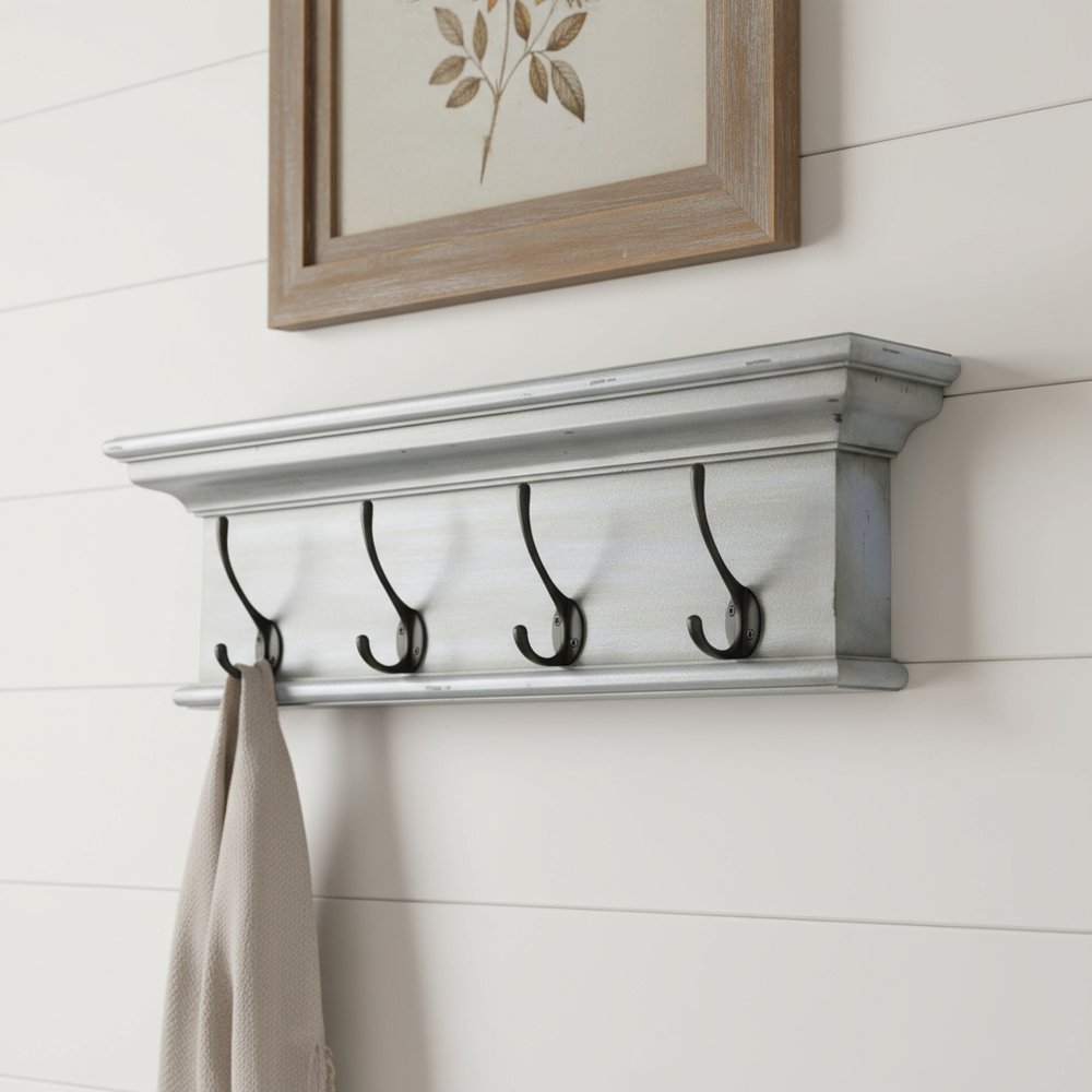 28" Black And Blue Solid Wood Four Hook Wall Mount Coat Rack. Coat hanger isolated on a plain white background, showing a wood surface.
