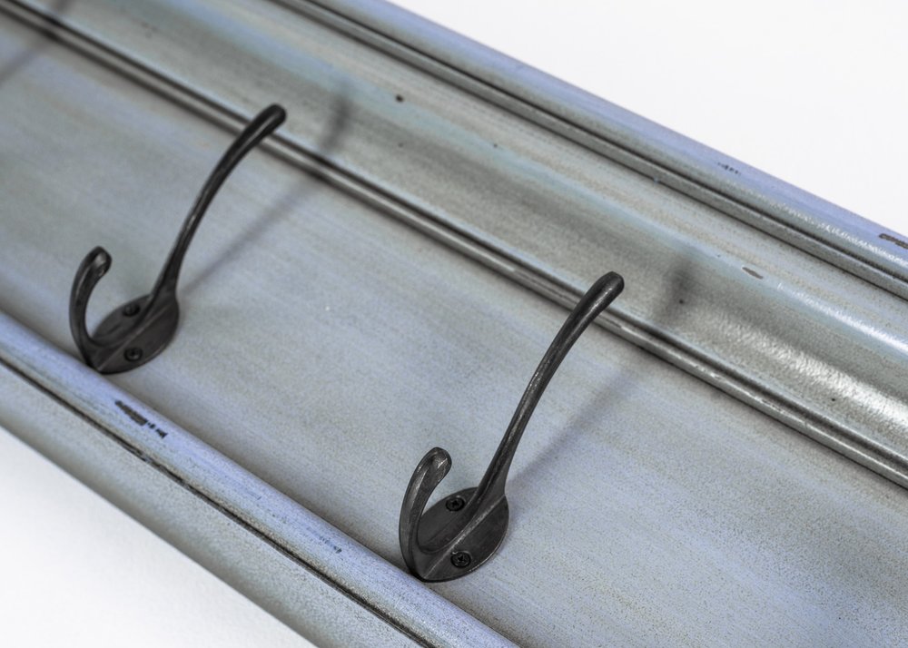 28" Black And Blue Solid Wood Four Hook Wall Mount Coat Rack detail shot of the blue wood finish.