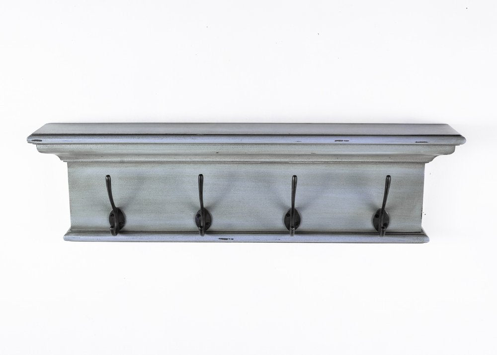 28" Black And Blue Solid Wood Four Hook Wall Mount Coat Rack. Coat hanger isolated on a plain white background, finished in blue wood.