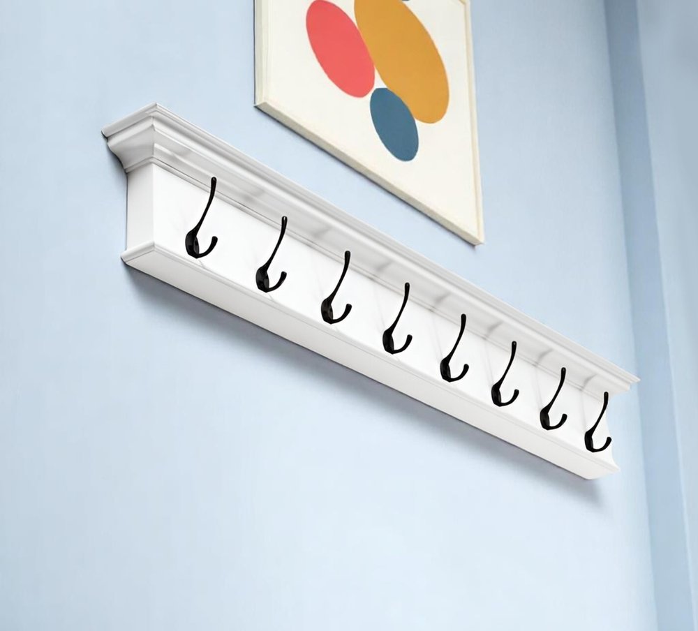 51" White Solid Wood Eight Hook Wall Mount Coat Rack shown outdoors on an outdoor setting.