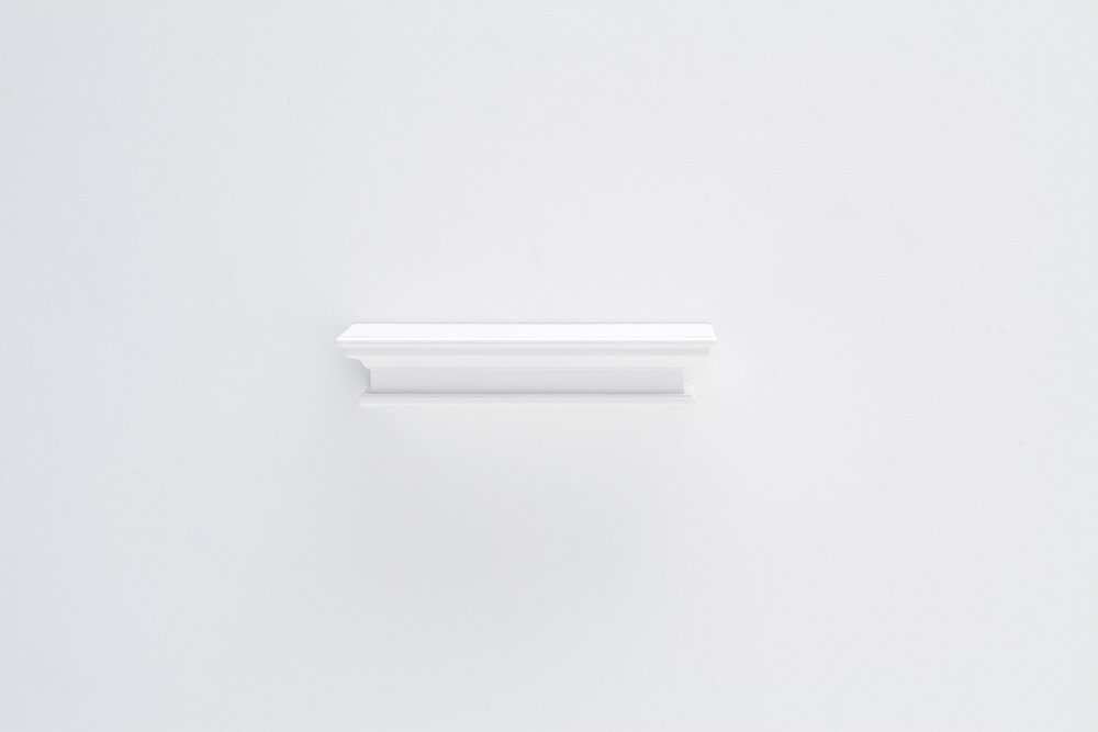 23" Classic White Floating Wall Shelf. Wall mounted shelve isolated on a plain white background, showing a white wood surface.