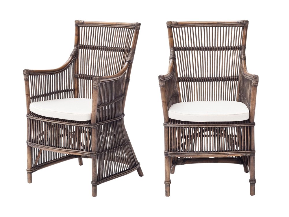 Set of Two Cream Rattan Outdoor Arm Chairs on a white background