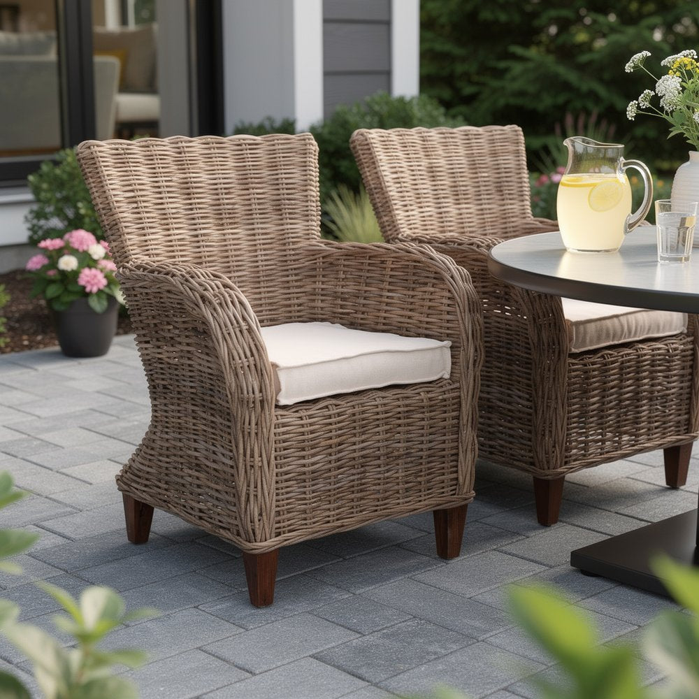 Set of Two Cream And Natural Woven Rattan Outdoor Dining Chairs with Cream Cushion in a home interior