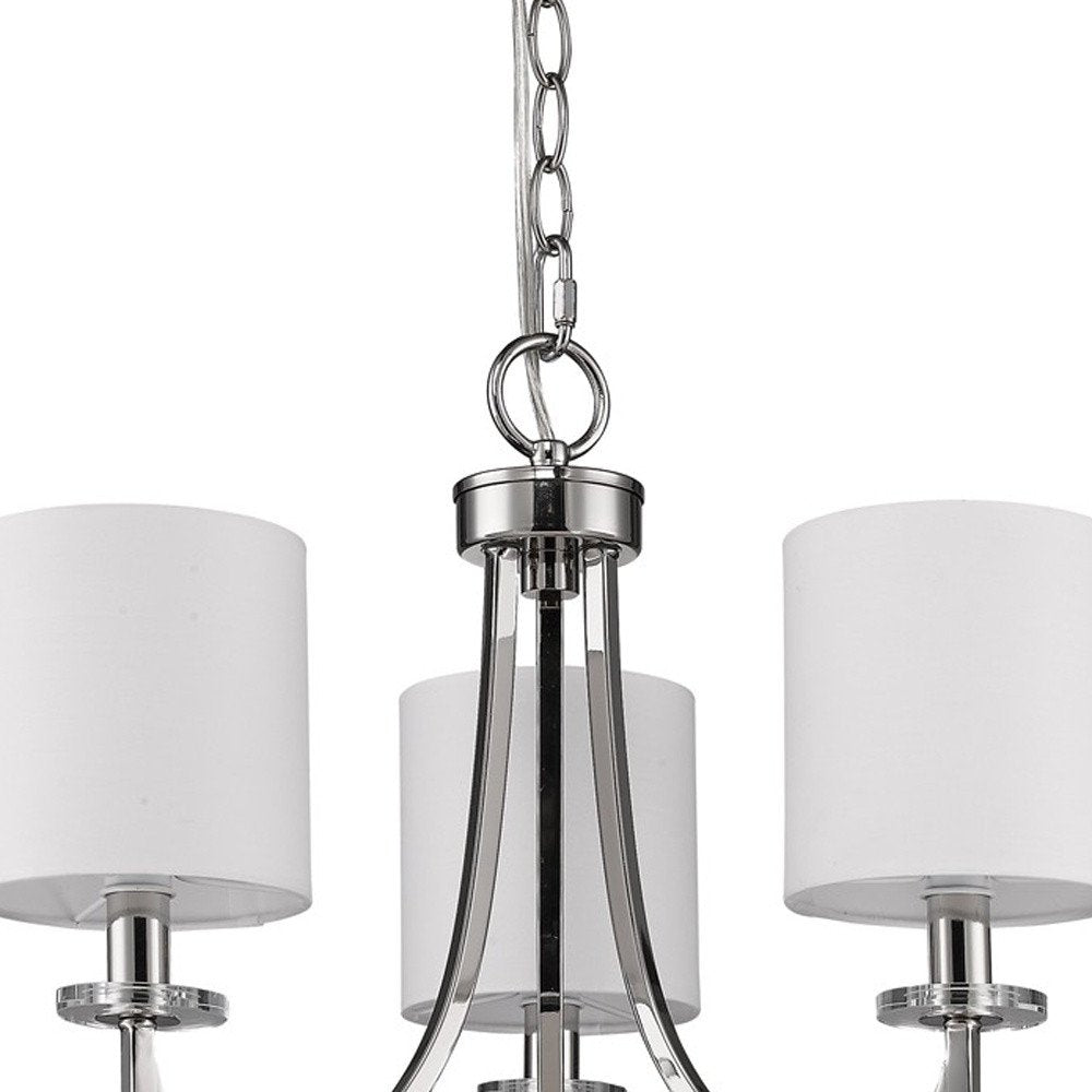 Silver Candle Style Three Light Metal Dimmable Chandelier With White Shades on a white background