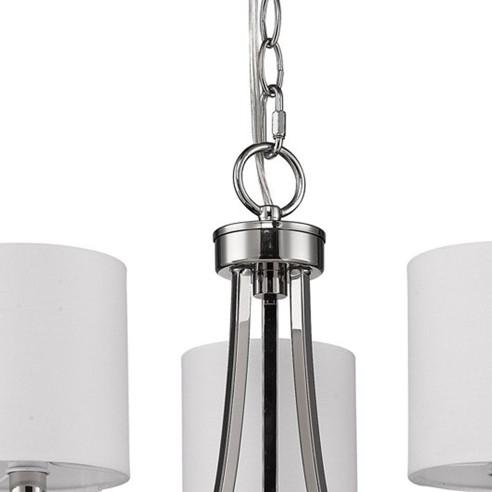 Silver Candle Style Three Light Metal Dimmable Chandelier With White Shades on a white background