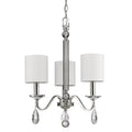 Silver Candle Style Three Light Metal and Crystals Dimmable Chandelier With White Shades on a white background
