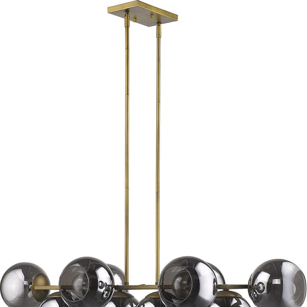 Lunette 10-Light Aged Brass Island Pendant on a white background