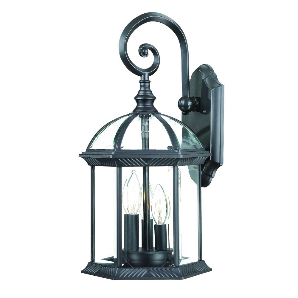 Matte black eastern lantern wall light with clear glass panels and three exposed bulbs, mounted on a white background.