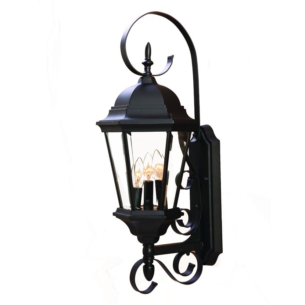 Black metal swing arm lantern wall light with three bulbs and clear glass panels, set against a white background.