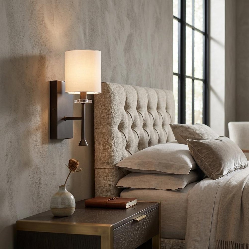 Minimalist Bronze Wall Sconce with Fabric Shade in a home interior