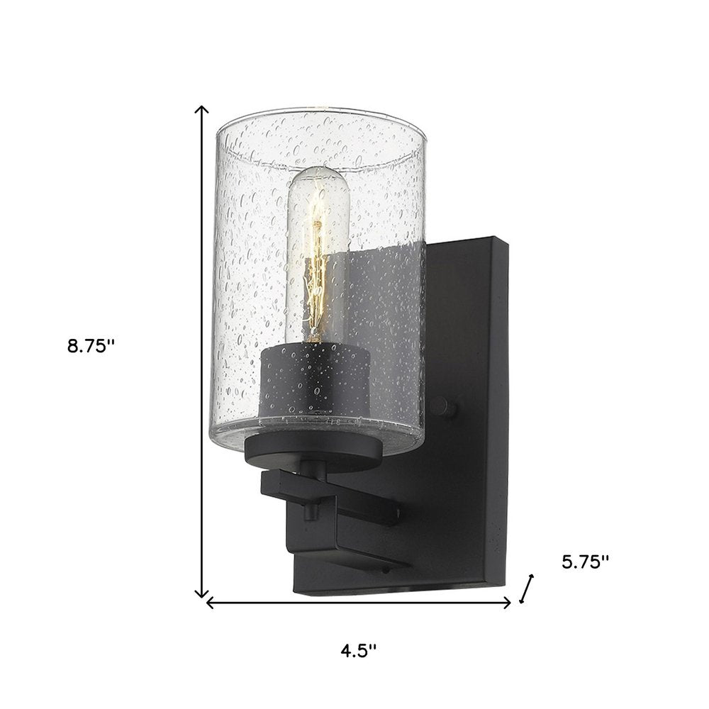 Black Metal and Textured Glass Wall Sconce on a white background