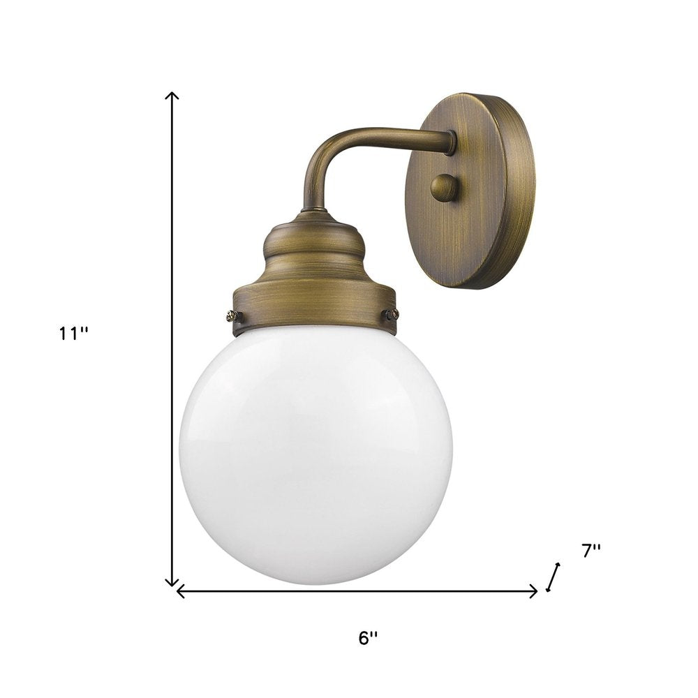One Light Gold Wall Sconce with Round Glass Shade on a white background
