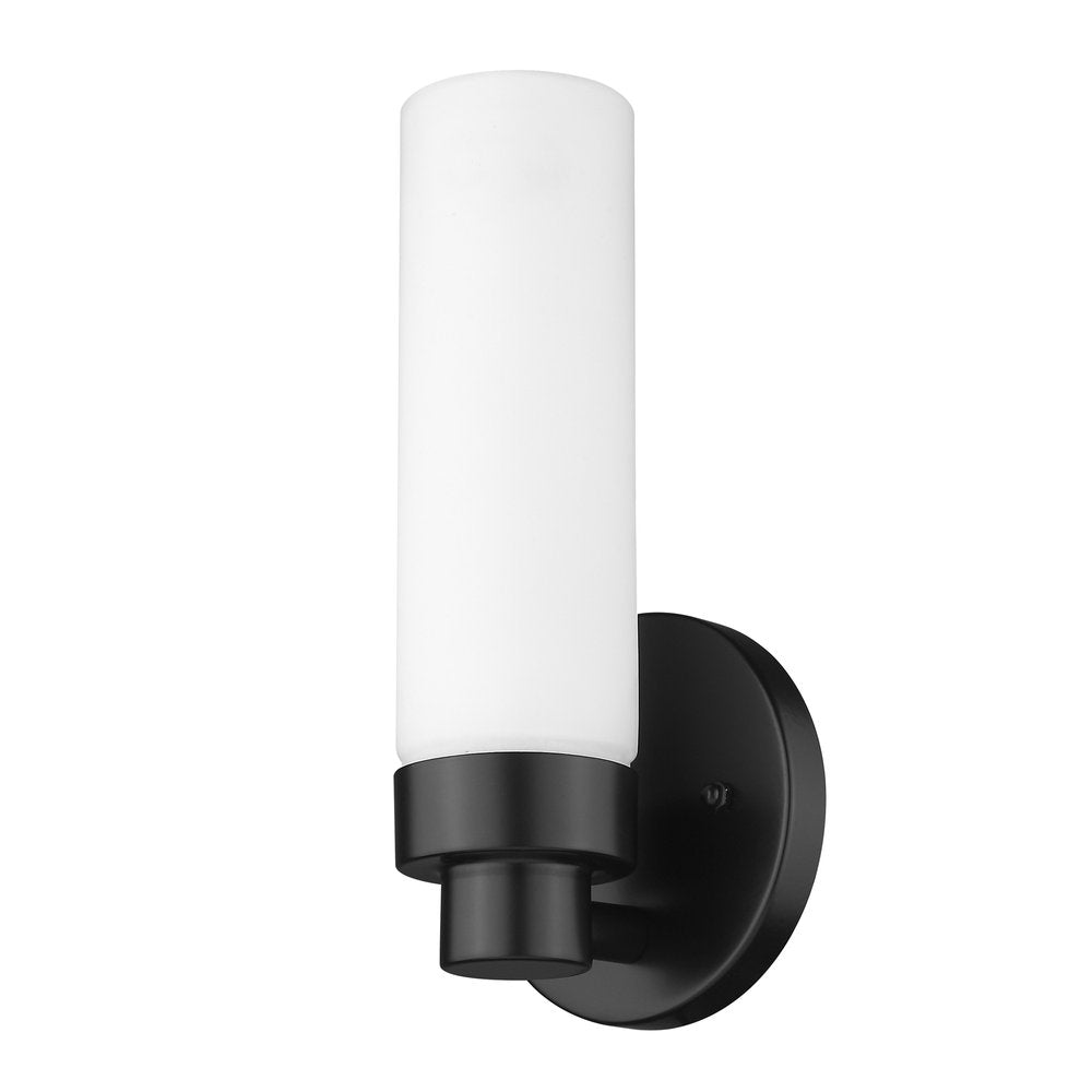 A narrow frosted glass shade wall light with a matte black finish and circular backplate on a white background.