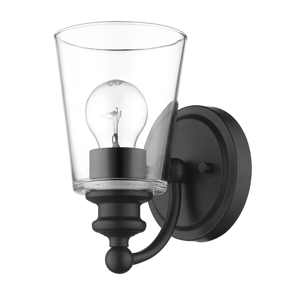 A matte black wall sconce with a clear glass shade and exposed light bulb on a white background.