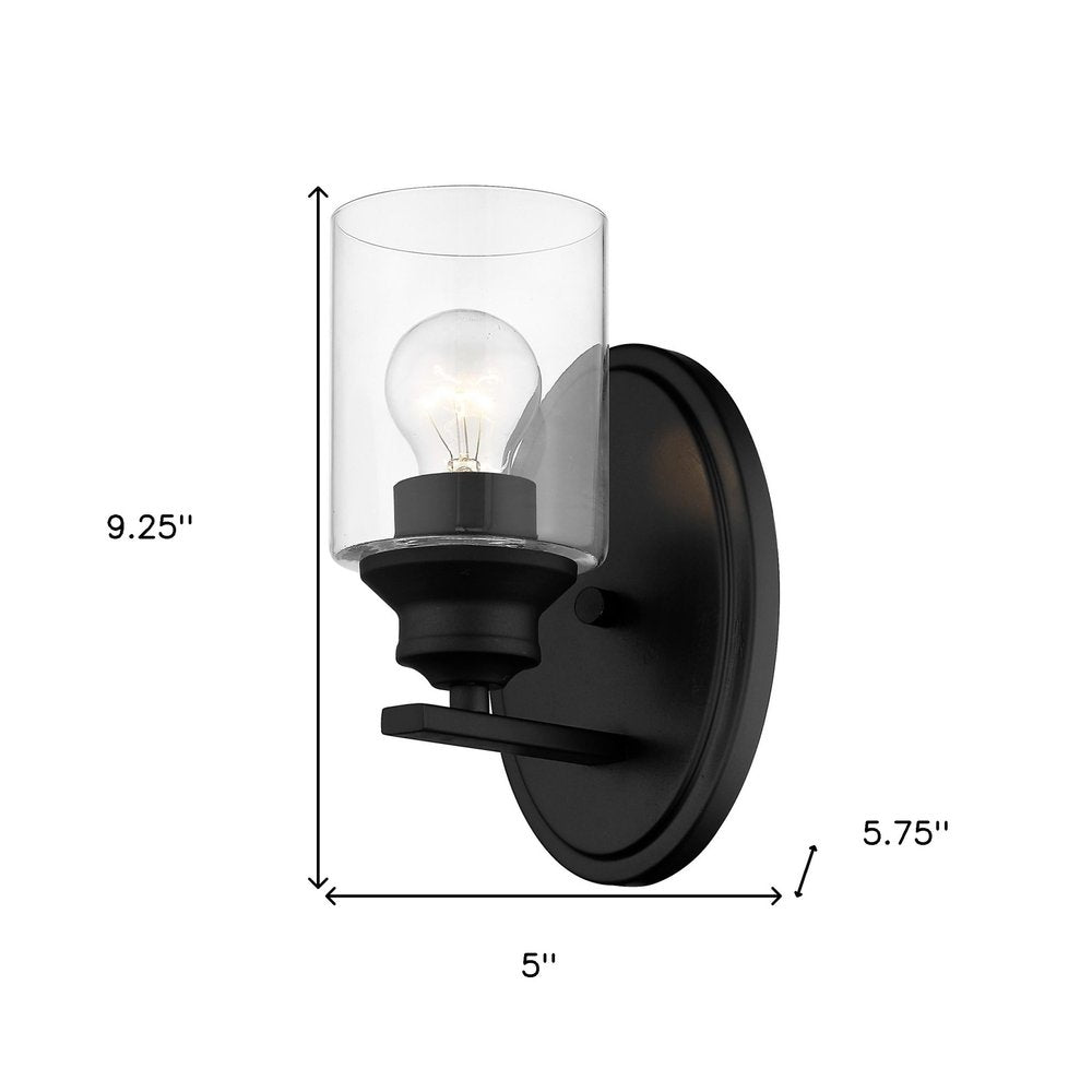 One Light Matte Black Wall Light with Clear Glass Shade on a white background