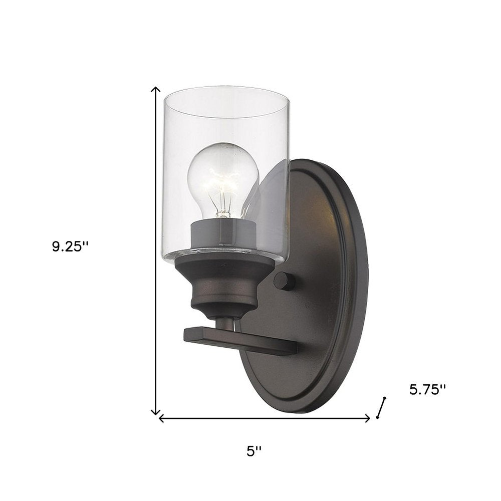 One Light Bronze Wall Light with Clear Glass Shade on a white background
