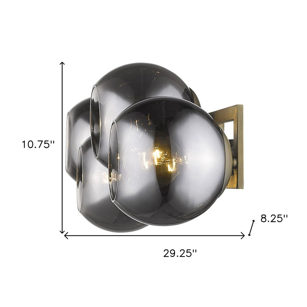 Lunette 4-Light Aged Brass Sconce on a white background
