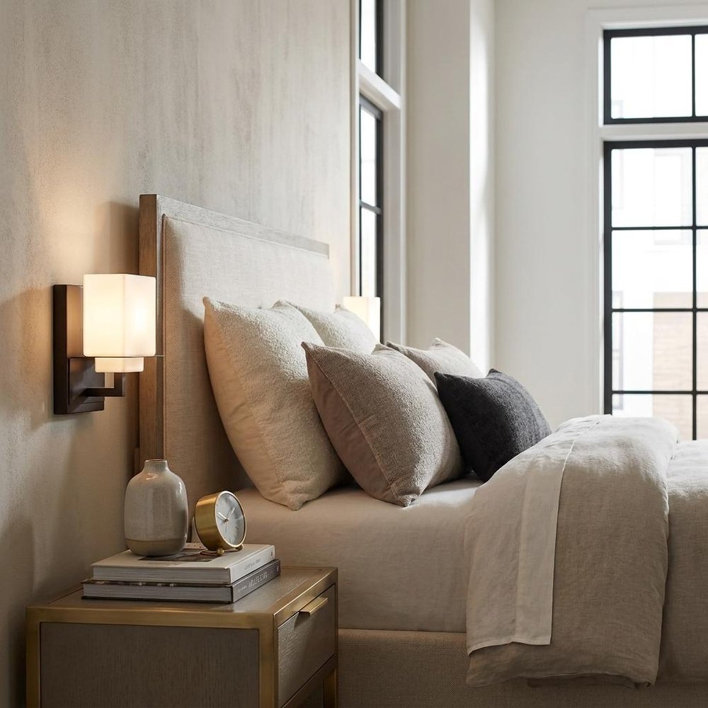 One Light Bronze White Glass Wall Sconce in a home interior