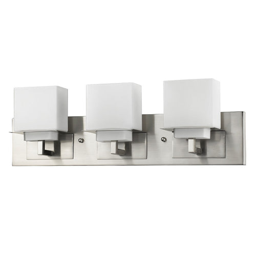 Brushed nickel flush mount sconce with three white frosted glass cube shades against a white background.