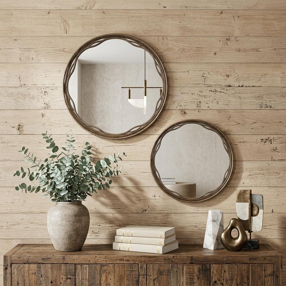 Set of Two Gold Round Ornate Framed Accent Mirrors in a home interior