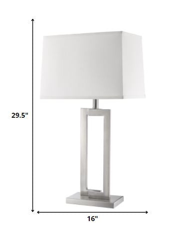 30" Silver Metal Table Lamp With White Rectangular Shade. Table lamp isolated on a plain white background, showing a silver metal surface.