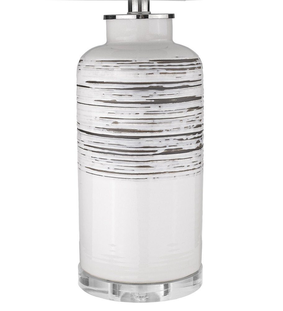 25" Black and White Ceramic Column Lamp With White Drum Shade. Lamp isolated on a plain white background, showing a white ceramic surface.