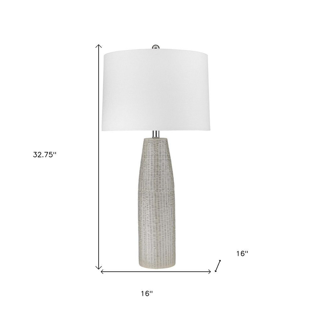 33" Light Gray Ceramic Table Lamp With White Drum Shade. Table lamp isolated on a plain white background, showing a light gray ceramic surface.