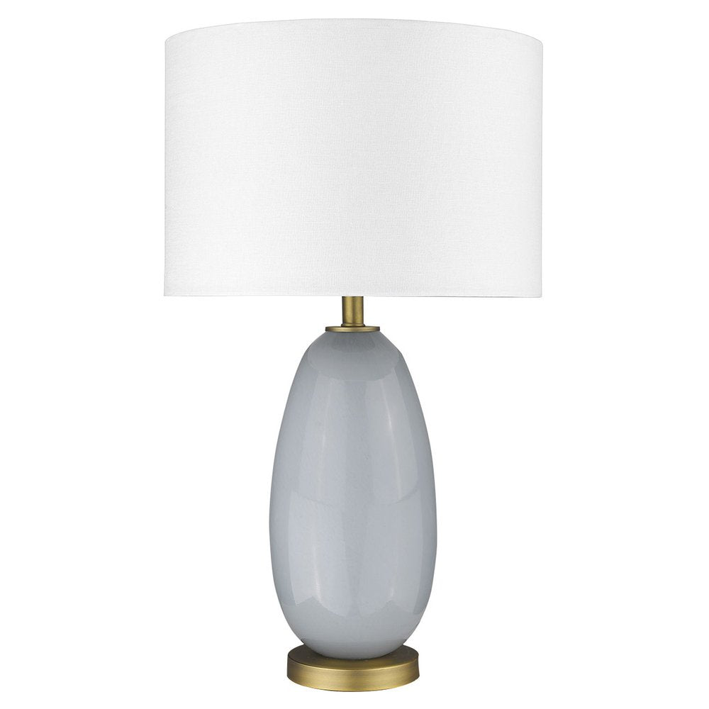 29" Light Gray Glass Table Lamp With White Drum Shade. Table lamp isolated on a plain white background, showing a light gray glass surface.
