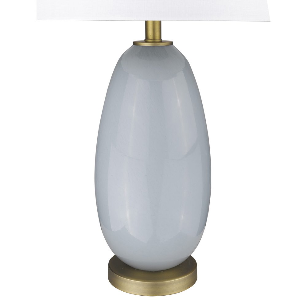 29" Light Gray Glass Table Lamp With White Drum Shade. Table lamp isolated on a plain white background, showing a light gray glass surface.