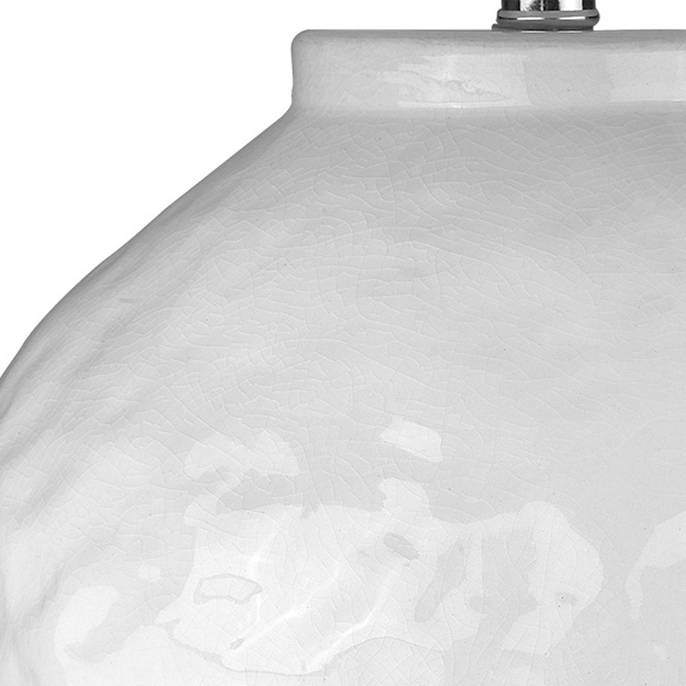 26" White Ceramic Table Lamp With White Drum Shade. Table lamp isolated on a plain white background, showing a white ceramic surface.