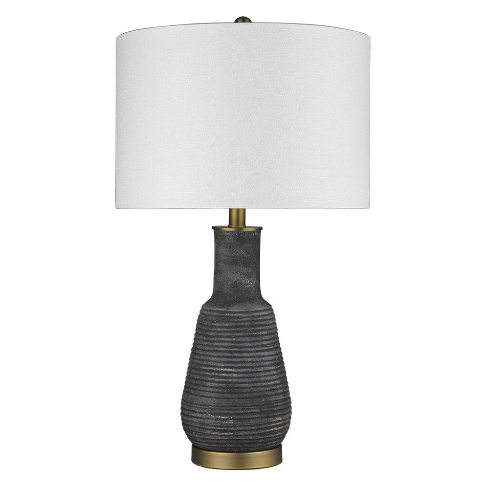 26" Distressed Black and Gold Ceramic Table Lamp With White Drum Shade. Table lamp isolated on a plain white background, showing a black ceramic surface.
