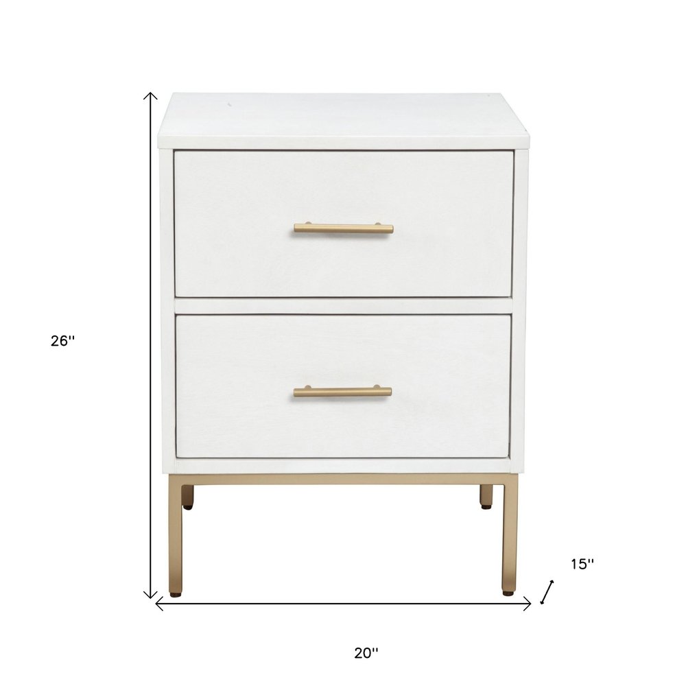 26" White And Gold Wood And Metal Two Drawer Nightstand. Nightstands & bedside table isolated on a plain white background, finished in gold metal.