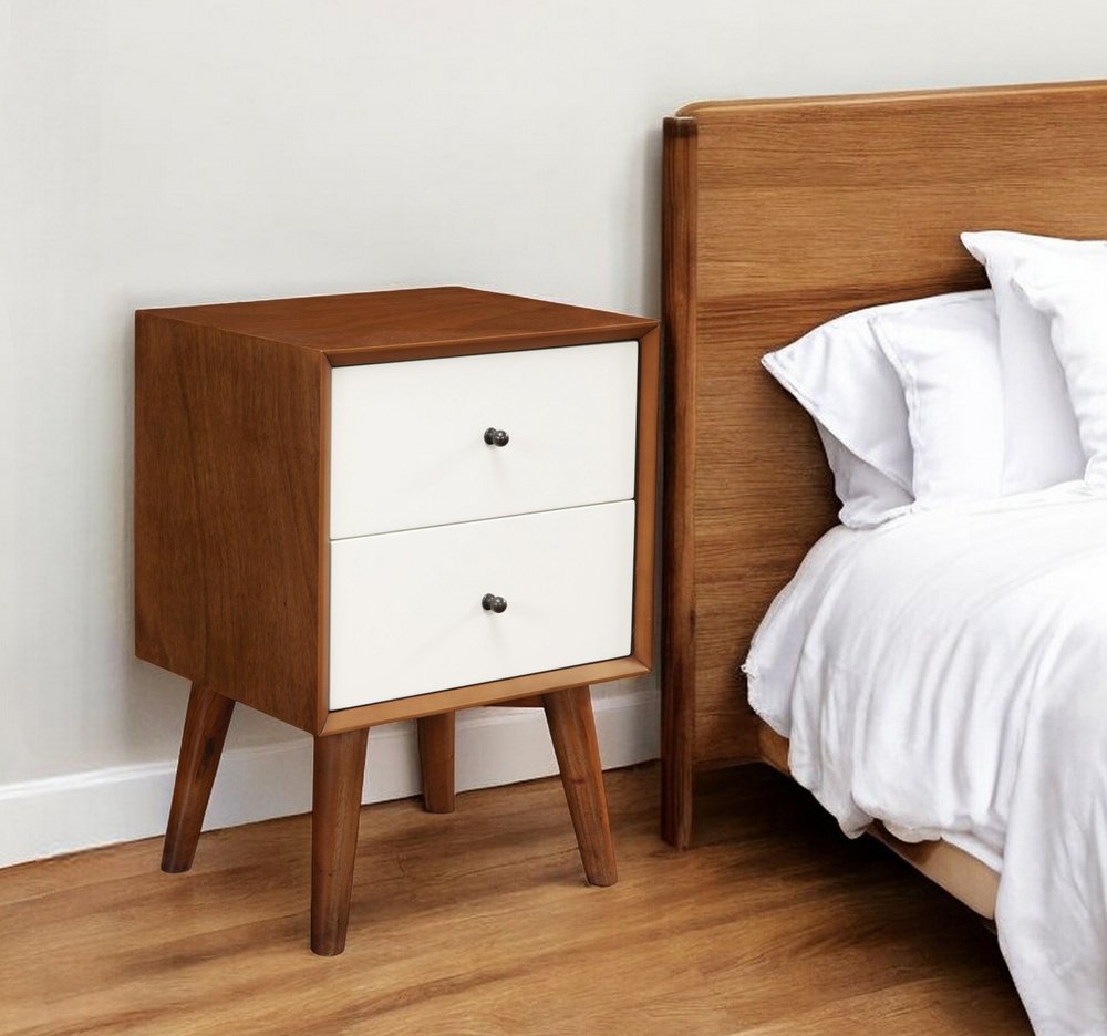 26" Solid Wood and Wood Two Drawer Nightstand styled in a furnished interior with an off-white wall on a wood floor in dark brown wood.