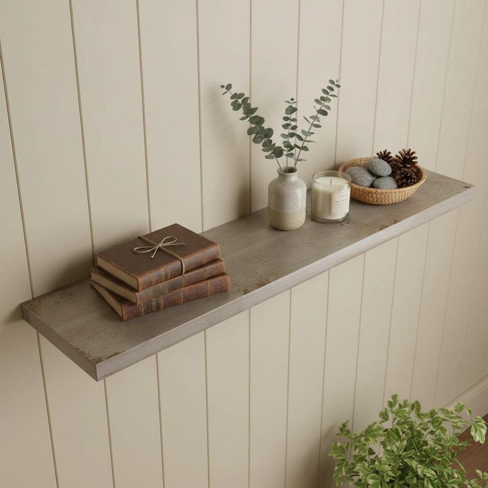 5" Solid Wood Wall Mounted Shelving Unit styled in a furnished interior with a cream wall on a wood floor in tan wood.