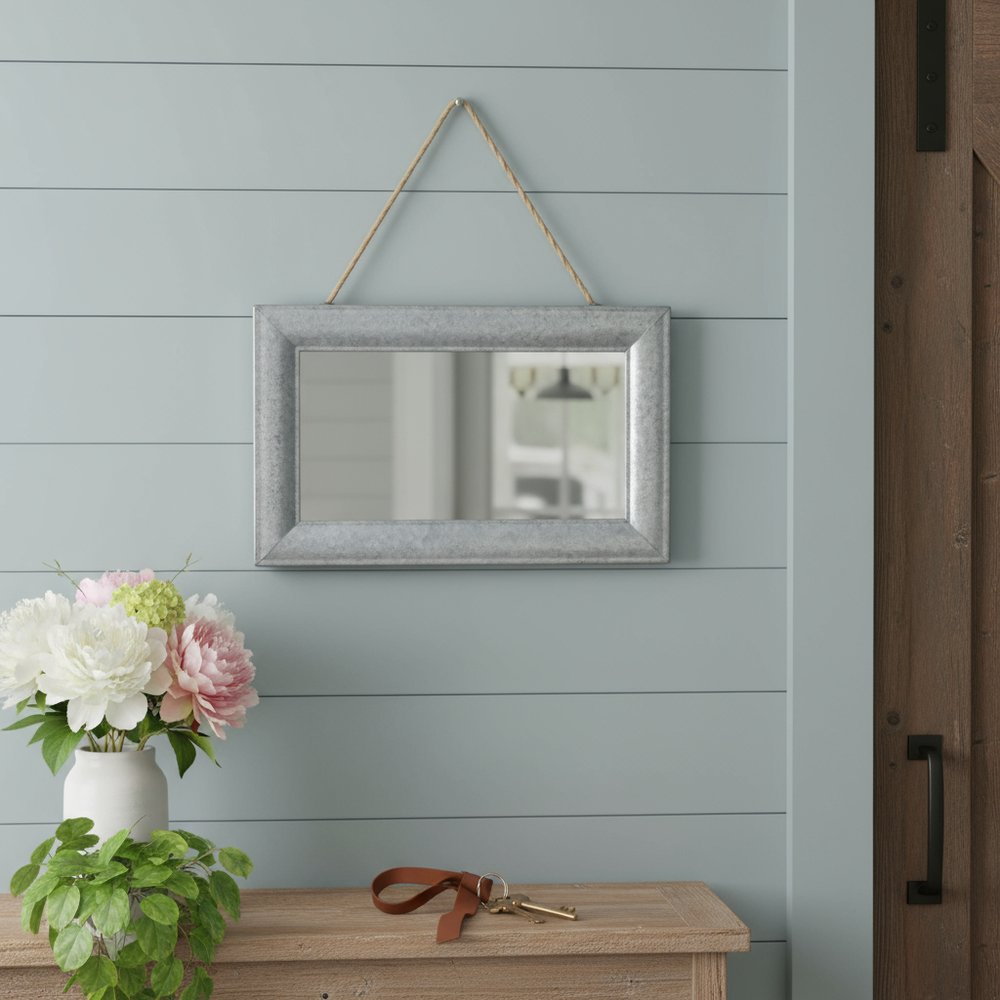 9" Silver Metal Framed Accent Mirror in a home interior