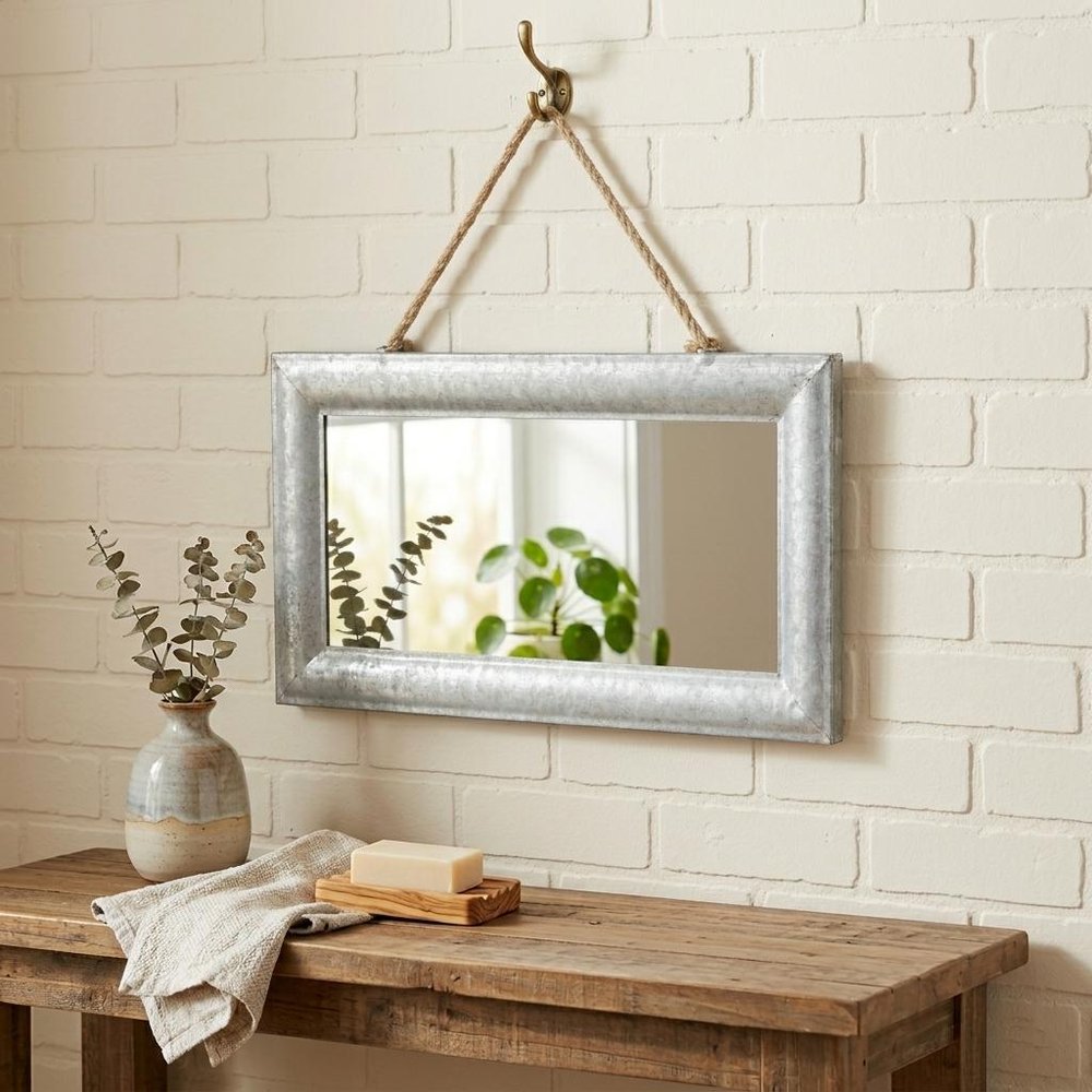 9" Silver Metal Framed Accent Mirror in a home interior