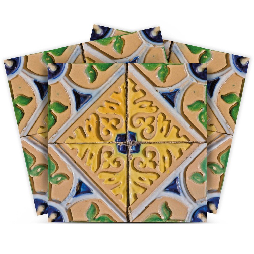 Four decorative tiles with yellow, blue, and green floral patterns on a tan background, arranged in a fan shape.