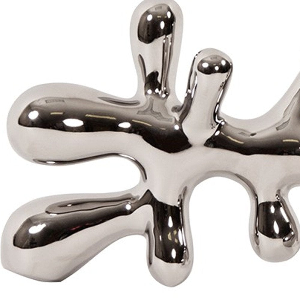 7" Silver Metal Tabletop Sculpture on a white background